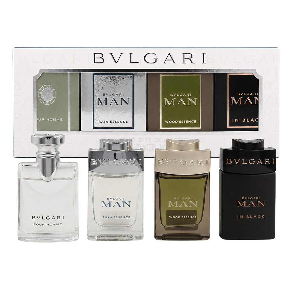 Bvlgari Gift Set Miniature Fragrance collection with four bottles in front of their matching box. The set includes Pour Homme, Rain Essence, Wood Essence, and In Black, shown in clear, silver, olive green, and black glass bottles.
