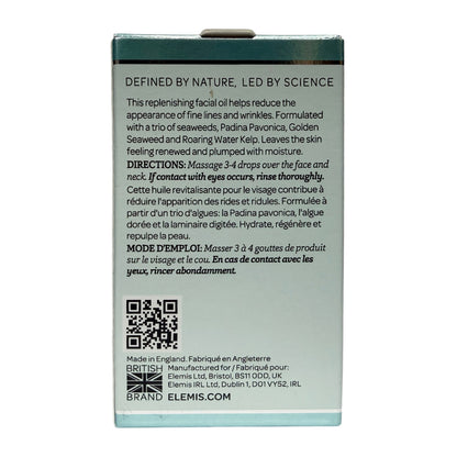 The back of a dark teal rectangular box for Elemis Defined by Nature, Led by Science facial oil, showing product details in English and French, with a QR code at the bottom.
