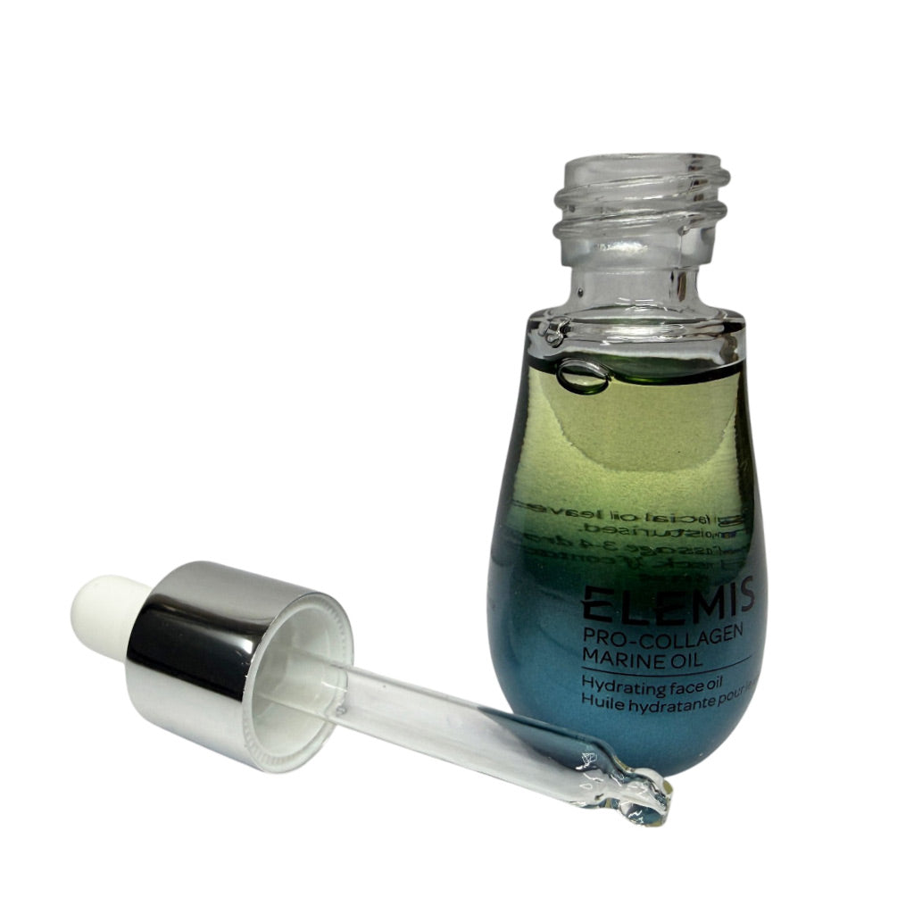 Elemis Pro-Collagen Marine Oil hydrating face oil in a clear glass bottle with a dropper, shown on a white background with the dropper placed beside the bottle.