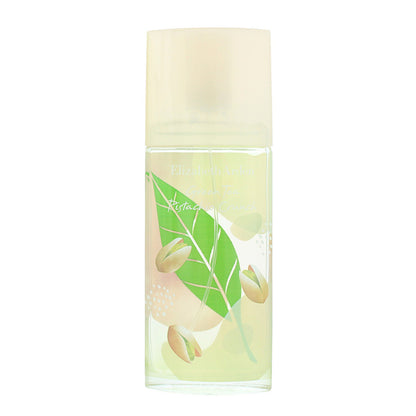 Elizabeth Arman Green Tea Pistachio Cream perfume bottle, featuring a clear glass body with a pale yellow-green liquid, a translucent cream cap, and an illustration of green leaves and pistachios on the front.