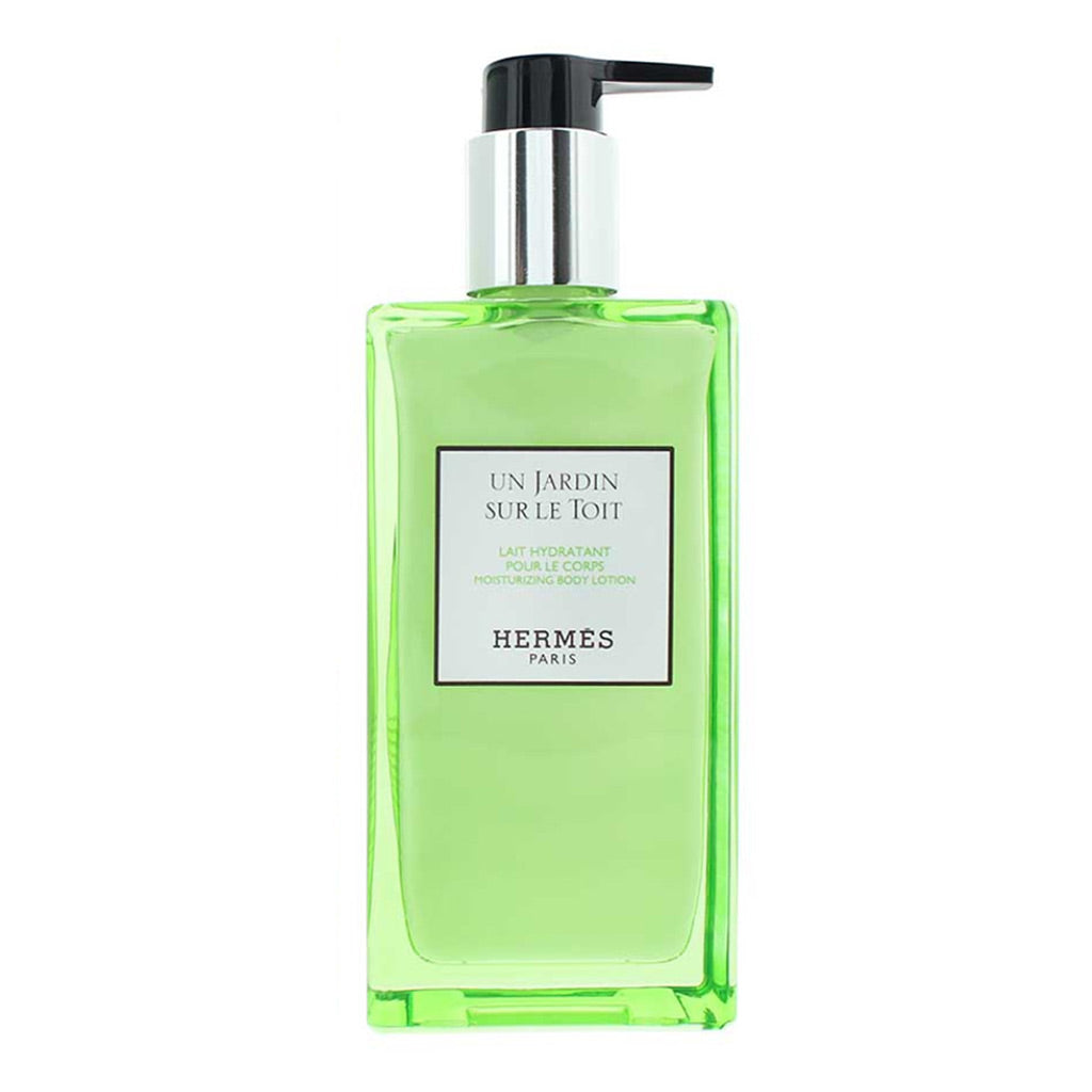 Hermes Un Jardin Sur Le Toit body wash in a translucent light green rectangular bottle with a black and silver pump dispenser, shown on a plain white background.