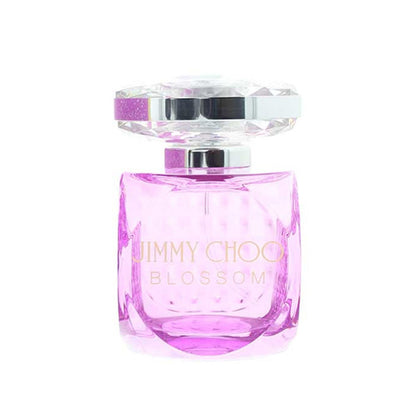 Jimmy Choo Blossom perfume bottle with a faceted clear cap, silver collar, and pink liquid inside a textured clear glass bottle, on a white background.