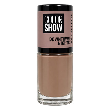 Maybelline Color Show Downtown Nights liquid makeup in a clear glass bottle with a black cap, showing a light warm beige shade.