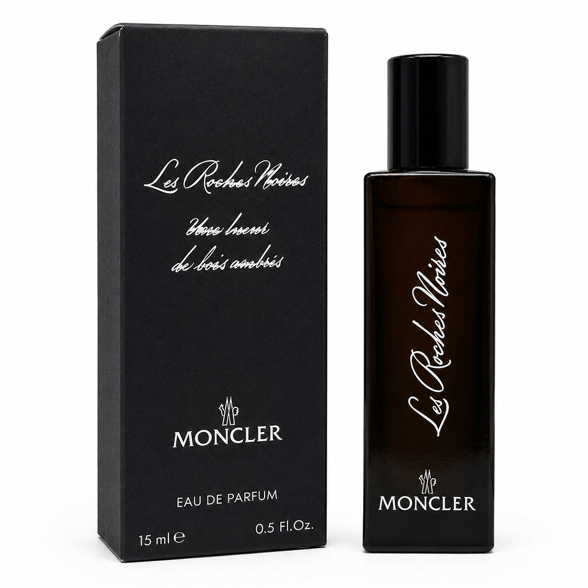 Moncler Les Roches Noires Eau de Parfum 15ml bottle next to its black packaging box, featuring white script lettering on a clean white background.
