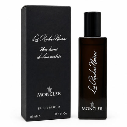 Moncler Les Roches Noires Eau de Parfum 15ml bottle next to its black packaging box, featuring white script lettering on a clean white background.