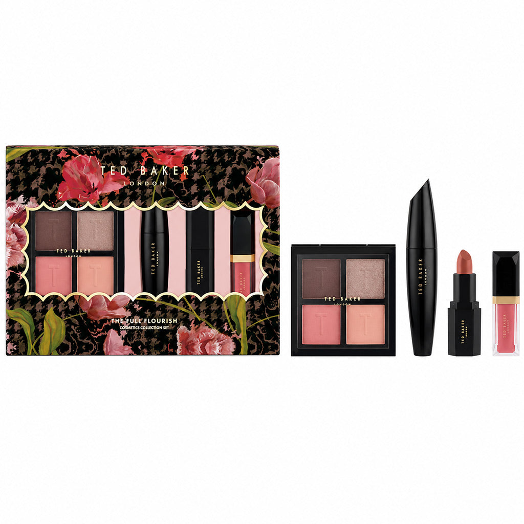 Ted Baker London Beauty by the Flower makeup gift set displayed on a white background, featuring a floral-patterned box with a peek of the contents, a four-pan eyeshadow palette, a black mascara tube, a pink blush stick, and a pink lip gloss.