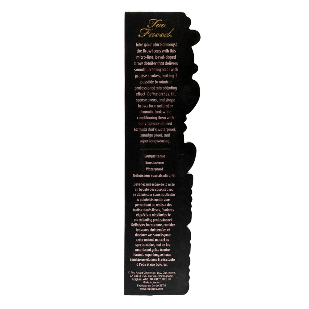 The back of a Too Faced Eye brow detailer product box, showing product description text in black and white on a black background.