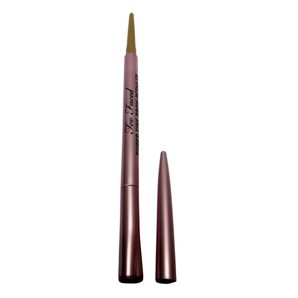 Too Faced Linedarker eyebrow pencil shown uncapped with the applicator tip removed and placed beside the barrel on a white background.