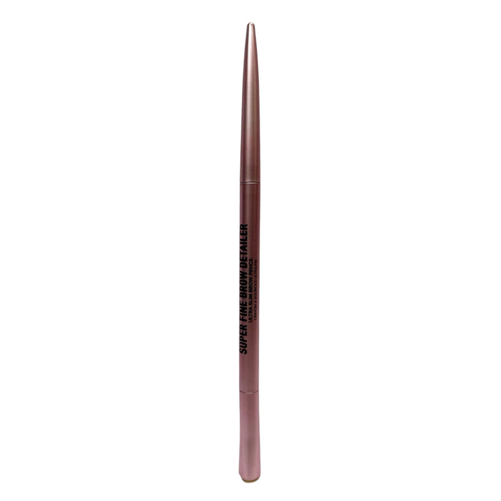 A single cosmetic eyebrow pencil in a metallic rose gold shade, featuring black text that reads 'SUPER FINE BROW DETAILER' on a plain white background.
