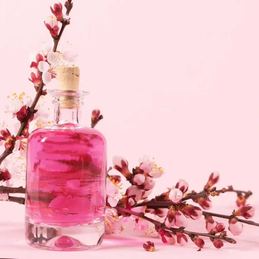 Woman spraying herself with fragrance